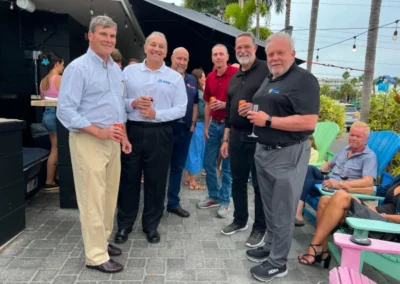 A group of individuals at an outdoor social gathering discussing warehousing and fulfillment services in the United States.