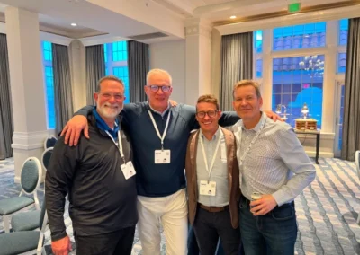 Four individuals at a professional event related to warehousing and fulfillment services in the United States.